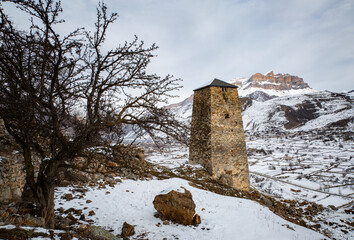 Ancient towers of Upper Balkaria in the winter in the snow