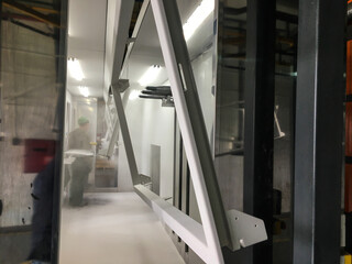 Powder coating line. Metal detail in the spray booth