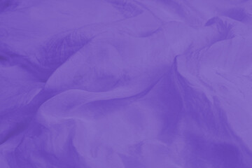 Soft smooth purple silk fabric background. Fabric texture.