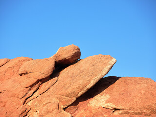 Red-orange rocks pushed up during the glacial and earthquakes beginnings in the Rocky Mountains