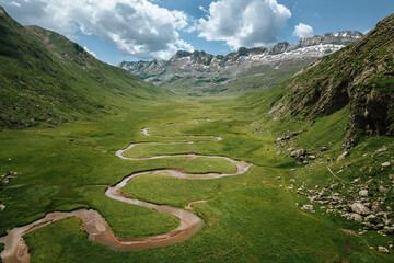 Aerial view of river flowing through valley in Pyrenees