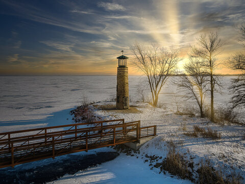 At the local park the old lighthouse still stands over the frozen lake