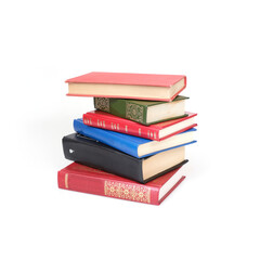 Stack of books in colour covers with white sheets isolated on a white background