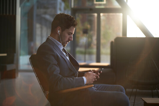 Man wearing a suit waiting for his job interview