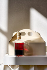 Elixir in bottle with blank label and a box