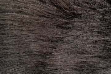 Beautiful dark faux fur as background, top view
