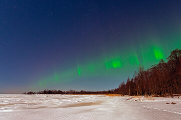 Aurora borealis green-purple on a clear winter night