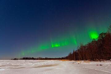 Aurora borealis green-purple on a clear winter night
