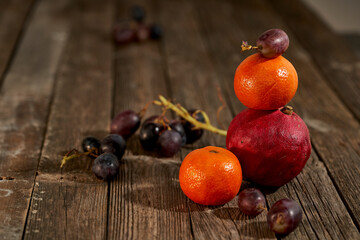 still life of pomegranates on wood  