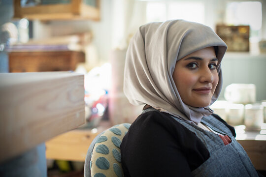 Portrait confident young Muslim woman in hijab