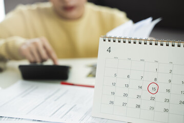 stressed young asian woman trying to find money to pay credit card deb