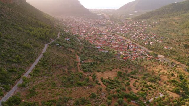 4k drone forward video (Ultra High Definition) of Leonidio town. Amezing summer sunrise on Peloponnese peninsula, Greece, Europe. Traveling concept background.