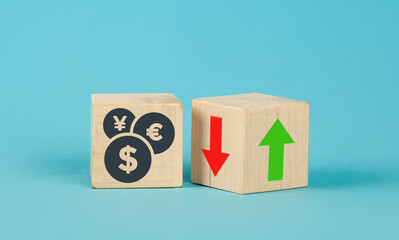 Exchange rate wooden cubes. Currency selection concept on wooden cubes with an arrow. Wooden blocks...
