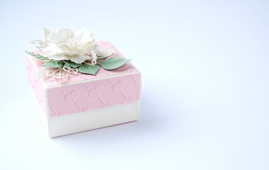 Pink pastel box with paper flowers isolated on white background. Valentine Day, Women's day, Holiday, Birthday, Mother's Day, Christmas concept postcard with copy space for text. 