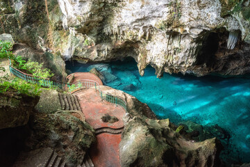 Three eyes cave in Santo Domingo, los Tres Ojos national park, Dominican Republic. Scenic view of limestone cave and crystal clear azure water of underground lake, nature landscape, travel background - 485637125
