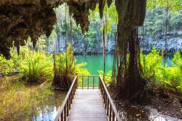 Three eyes cave in Santo Domingo, los Tres Ojos national park, Dominican Republic. Scenic view of limestone cave, beautiful lake and tropical plants, nature landscape, outdoor travel background - obrazy, fototapety, plakaty