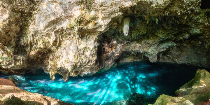Three eyes cave in Santo Domingo, los Tres Ojos national park, Dominican Republic. Scenic view of limestone cave and crystal clear azure water of underground lake, nature landscape, travel background