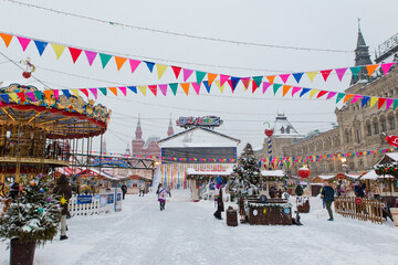 Moscow, Russia, February 7, 2022, winter fair on Red Square in the morning. View of the ice rink and Channel 1 TV 