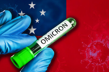 Samoa outbreak of omicron variant. Hand holds a test tube with covid-19 virus omicron in front of...