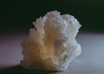 Calcite cluster, isolated on blurred dark background.  Good Luck vibes. Selective Focus. Copy Space.