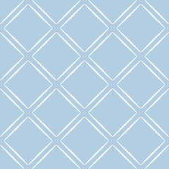 Ornament of rhombuses on blue background. Geometric white pattern of dots. Vector seamless pattern.