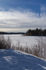 Frozen Astotin Lake on a Partially Cloudy Winter Day