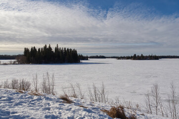 Frozen Astotin Lake on a Partially Cloudy Winter Day