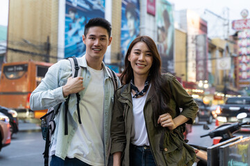 Portrait of Asian young couple travel in city for honeymoon trip. 