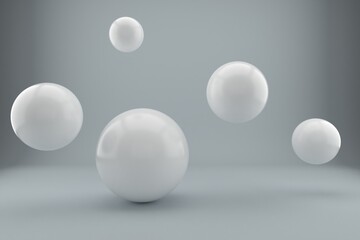 Suspended balls on a white background. 3D image rendering.
