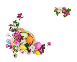 Obraz na płótnie Canvas Basket with Easter eggs and flowers apple tree on a white background with space for text. Easter decoration. Top view, flat lay