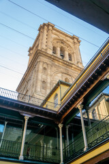 Bell tower of the cathedral of Granada (Spain) seen from the interior patio of an old house next to it