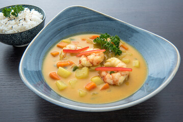 Thai Yellow Curry soup, Coconut milk soup with king size prawns, potatoes, carrots, onion, green beans and a side of Thai Jasmine rice.