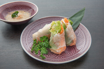 thai Fresh Summer Rolls, with salad and carrots, tipical thai cuisine , close-up photography