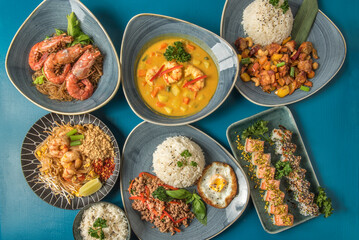 Composition of thai typical plats and japan Uramaki photographed from above 