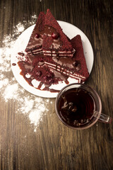 Cake with cranberries, hot chocolate and cream.