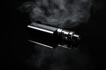 Electronic cigarette and smoke on black background