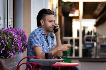 Portrait of a young man walking through an empty city in the early morning.