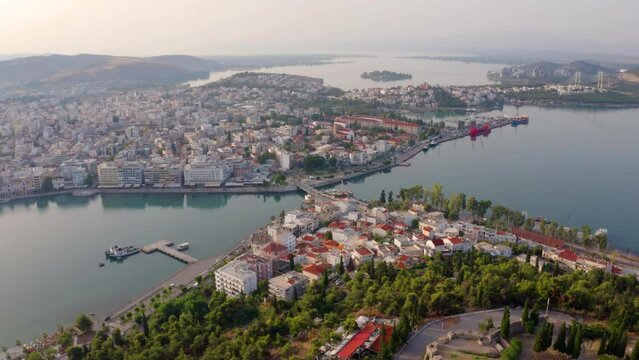 4k drone flight back footage (Ultra High Definition) of Chalcis town. Splendid seascape of Aegean sea, North Euboean Gulf. Stunning morning scene of Euboea island, Greece, Europe.