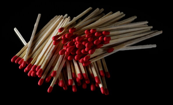 Fire matches pile isolated on black  