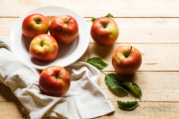 Ripe apples on wooden background. Free space for text.