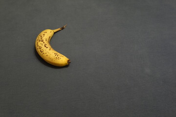 Banana against a blue gray background