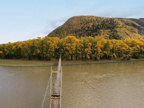Aerial view of a small footbridge crossing Mtkvari river near Tashiskari, Georgia.