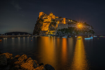 Night view of Aragonese Castle (Castello Aragonese), the most famous landmark of Ischia, Campania...