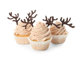 Delicious Christmas cupcakes with chocolate reindeer antlers on white background