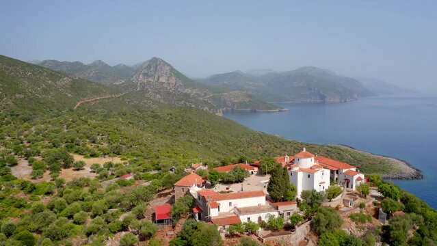 4k drone flight down footage (Ultra High Definition) of popular tourist destination - Moni Evaggelistrias church. Splendid summer scene of Peloponnese peninsula, Greece, Europe.