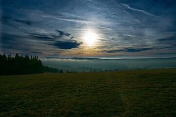 Fototapeta na wymiar sunset in the forest, grass on a mountain Horni blatna Jindřišské skály – Na strašidlech 