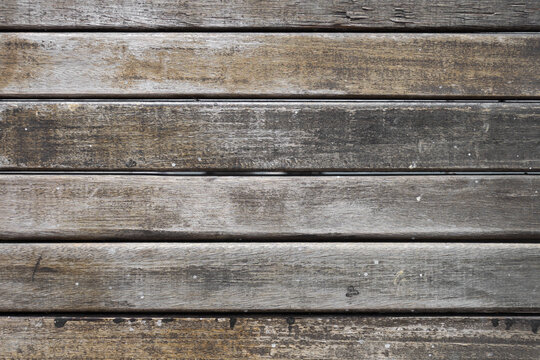 Background of rustic wooden slats arranged horizontally.