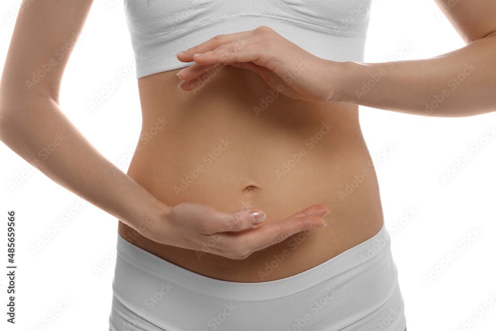 Poster Woman holding hands near belly against white background, closeup