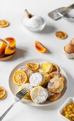Cottage cheese pancakes with ingredients: gluten free flour, maple syrup, oranges' peels, eggs