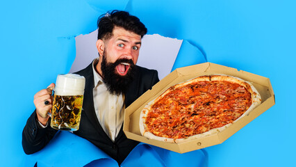 Bearded man with delicious pizza and cold beer. Italian food. Pizza delivery concept.